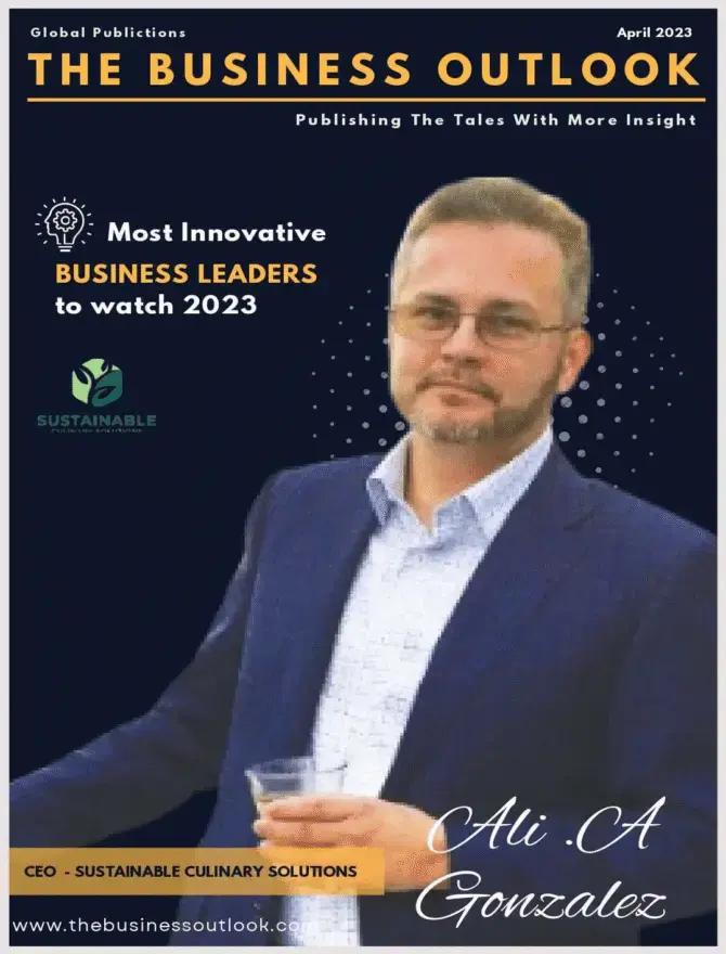 a man in a suit holding a glass